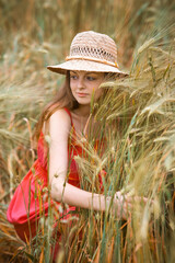 Happy Girl in a Wheat Field - 745237382