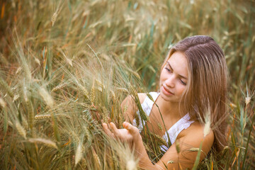 Happy Girl in a Wheat Field - 745237391