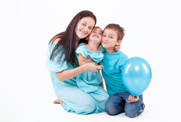 Happy mother with children on a light background - 745237537
