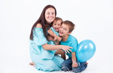 Happy mother with children on a light background - 745237555