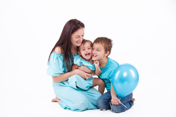 Happy mother with children on a light background - 745237572