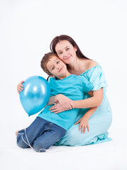 Happy mother with son on a light background - 745237599