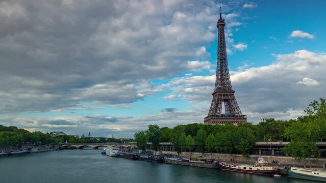 PARIS, FRANCE - FEBRUARY 20, 2024 : Timelapse motion hyperlapse view of the Eiffel Tower and Champ de Mars, famous touristic landmark.