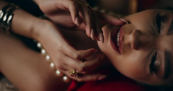 Attractive woman touching face and body