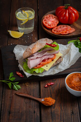 Cervelat sausage cut into pieces on a cutting board