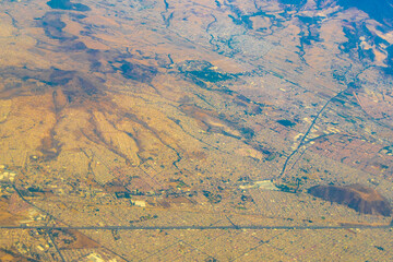 Flying airplane over Mexico Clouds Sky Volcanoes Mountains City desert.