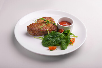 Meat steak with tomato sauce and herbs