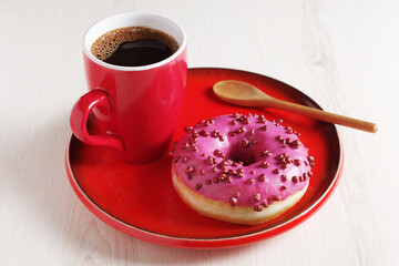 Pink donut and coffee cup