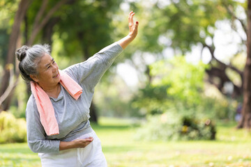 asian senior woman workout and practice tai chi in the park - obrazy, fototapety, plakaty