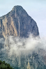 Foggy weather, Baunei, rocky coast near Sa Perda Liana. Ogliastra, Sardinia, Italy