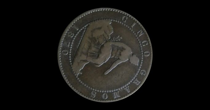 Obverse of Spain coin 5 centimos 1870, isolated in black background. Animation in 4k resolution video.