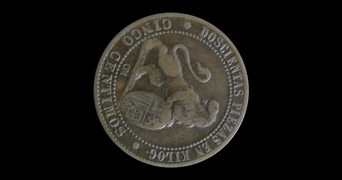 Reverse of Spain coin 5 centimos 1870, isolated in black background. Animation in 4k resolution video.