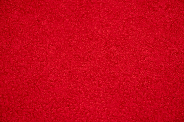 Macro shot of a vivid red fabric texture, ideal for a colorful and vibrant background.