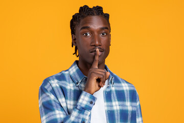 Keep Silence. Portrait Of Young Black Guy Showing Shh Gesture At Camera