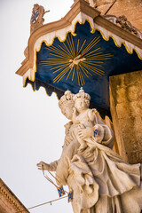 Statue of the Madonna with child on the corner of the Church of the Annunciation - 745272917