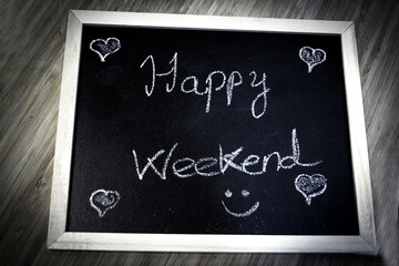 Fototapeta premium Happy weekend written with chalk
