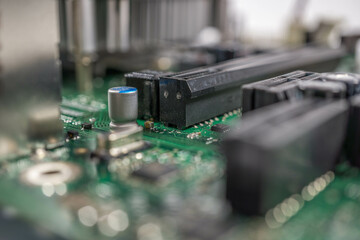 motherboard with a processor and a battery, in the style of selective focus