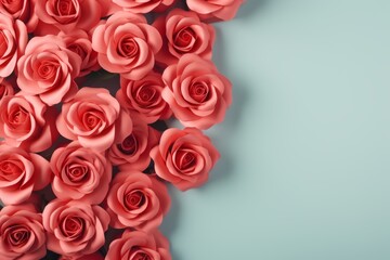 Fototapeta premium Red roses bouquet on pastel background. Birthday, womens day, mothers day. Flat lay, top view