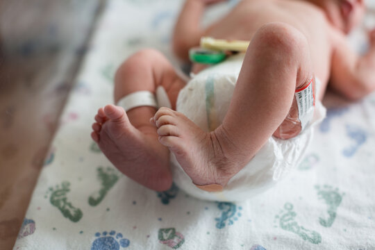 Close-up of a Newborn Baby boy in a hospital lying on a blanket