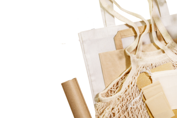 Eco friendly shopping, delivery service. Sustainable still life with textile bags, paper bag, mesh bag, wrapping paper and twine on transparent background. Zero Waste and plastic free concept