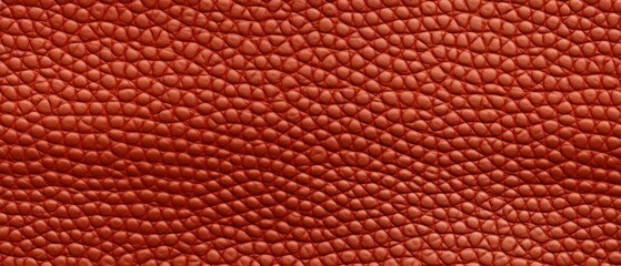 Textured Red Leather Close-Up Background. Close-up of red leather texture with a pattern of interwoven lines, suitable for backgrounds or detailing