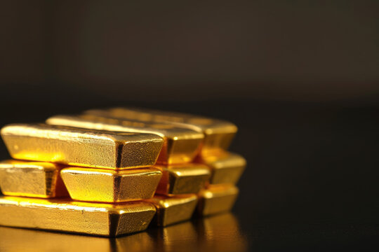 Stack of Gold Bars on Table