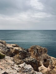 Fototapeta na wymiar Rocky coastline, ocean horizon, rocks at the ocean, cliffs