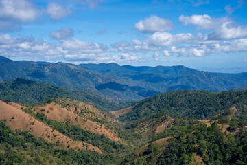 Naklejka premium Ta Nang - Phan Dung route with milestone between 3 provinces through grass hills and forests in Song Mao Nature Reserve