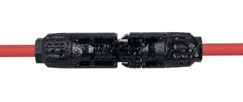 Waterproof Connector Attached to Red Cable. Solar Panel MC4 Connector Detail