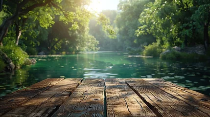 Zelfklevend Fotobehang Wooden table in blurry green forest and lake or swamp A refreshing and relaxing concept. © Morng