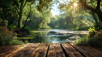 Poster Wooden table in blurry green forest and lake or swamp A refreshing and relaxing concept. © Morng