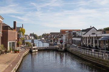 Fototapeta premium Lock in the river Oude Rijn in the Dutch town of Bodegraven.
