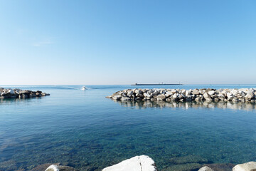 View from the coast of Livorno with the breakwater Diga della Vegliaia . Tuscany, Italy