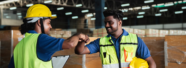 Group warehouse workers shake hands to celebrate and be happy in the warehouse., Industrial and...
