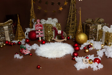 photo zone for a photo shoot. Golden Christmas trees. Christmas garland of lights