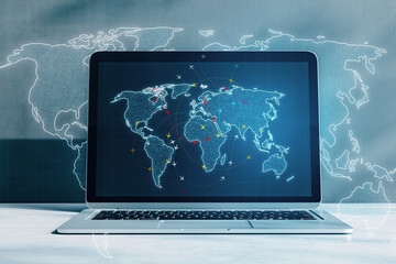 Illustrating global connectivity, this laptop features a world map with connecting lines for networking