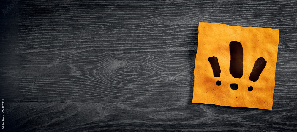 Poster Close up of orange note paper with exclamation marks on wide dark wooden desktop with mock up place. Questions and answers concept. 3D Rendering.
