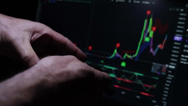 Male hand counting Argentine Peso on investment profits from the wallet.