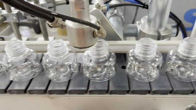 Quality control of bottles. Pet material. Small bottle, cosmetics.