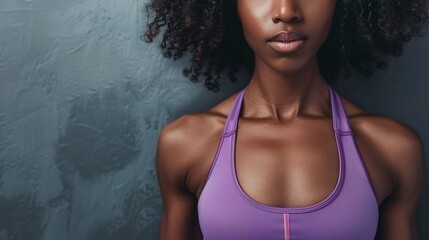 afro american fitness model torso in purple top with well defined abdominal muscles, showcasing strength and athleticism with copy space for text - obrazy, fototapety, plakaty