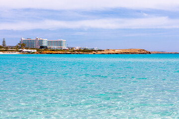  Luxury beach holiday in Ayia Napa, Cyprus. Hotel at coast of Mediterranean Sea with turquoise water