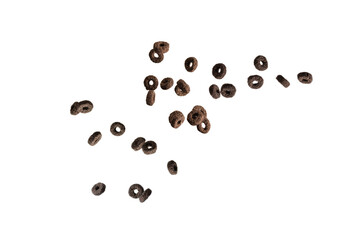 Chocolate rings cereal spill out into a bowl. Breakfast.