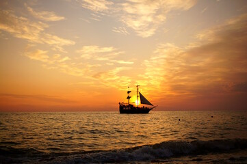 The ship sails on the sea during sunset. Black sea. Sea voyage.
