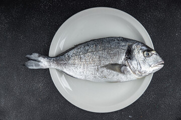 sea bream raw fish seafood fresh eating cooking meal food snack on the table copy space food background rustic top view © Alesia Berlezova