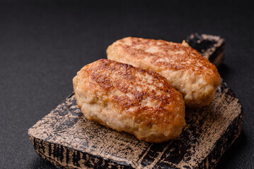 Delicious fresh fried minced fish cutlets with spices and herbs
