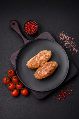 Delicious fresh fried minced fish cutlets with spices and herbs