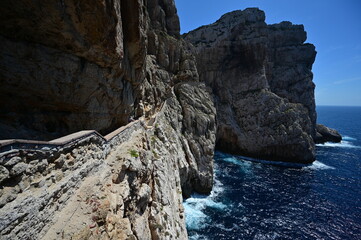 A stairway called Escala del Cabirol, cut into the cliff, leads from the top of the cliff at Capo Caccia down to the entrance to Neptune's Grotto
