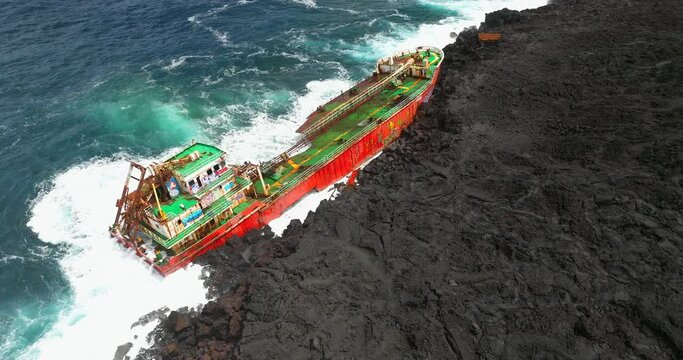 Saint Philippe, Reunion island, Tanker Tresta Star stranded on lava shore in Reunion island after Batsirai hurricane
