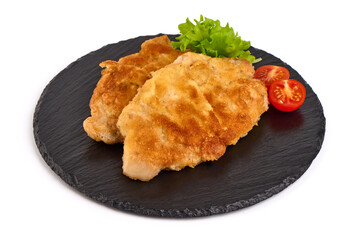 Fried pork schnitzels in breadcrumbs, isolated on white background.