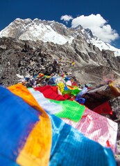 view of Lhotse peak with prayer flags from Kongmala pass - obrazy, fototapety, plakaty